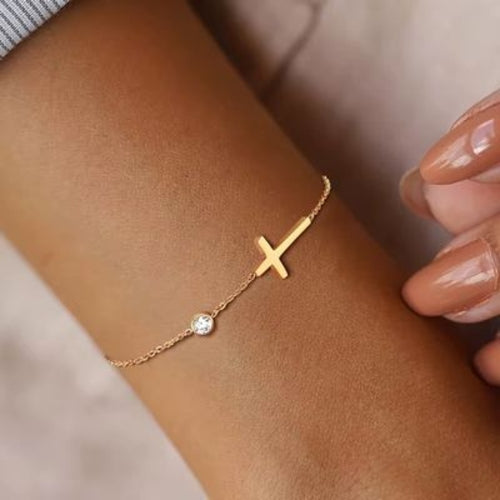 Bracelet / chaîne de cheville croix