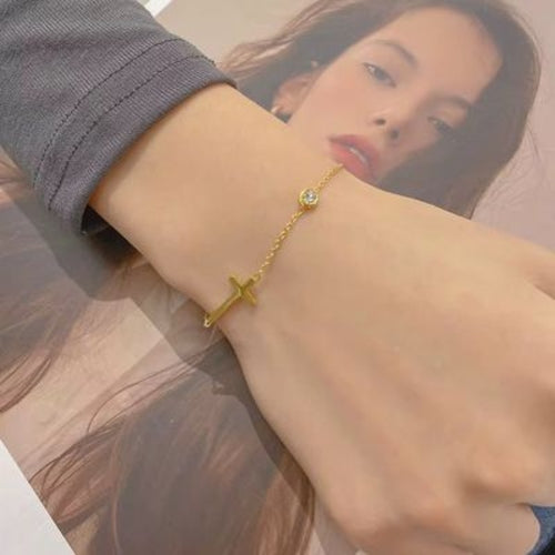 Bracelet / chaîne de cheville croix